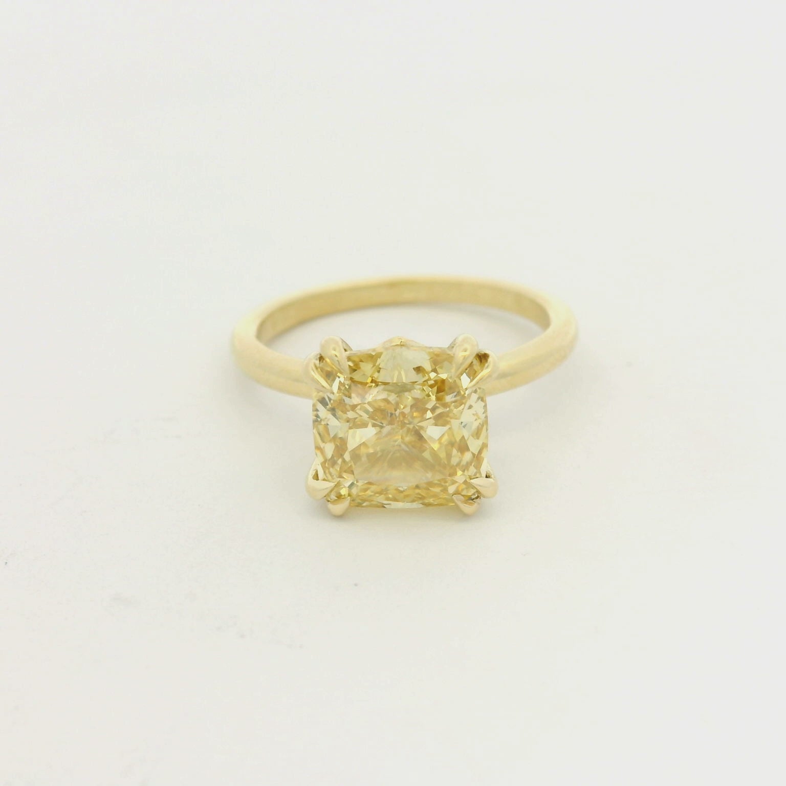 Oval Cut Diamond Solitaire Ring in Yellow Gold