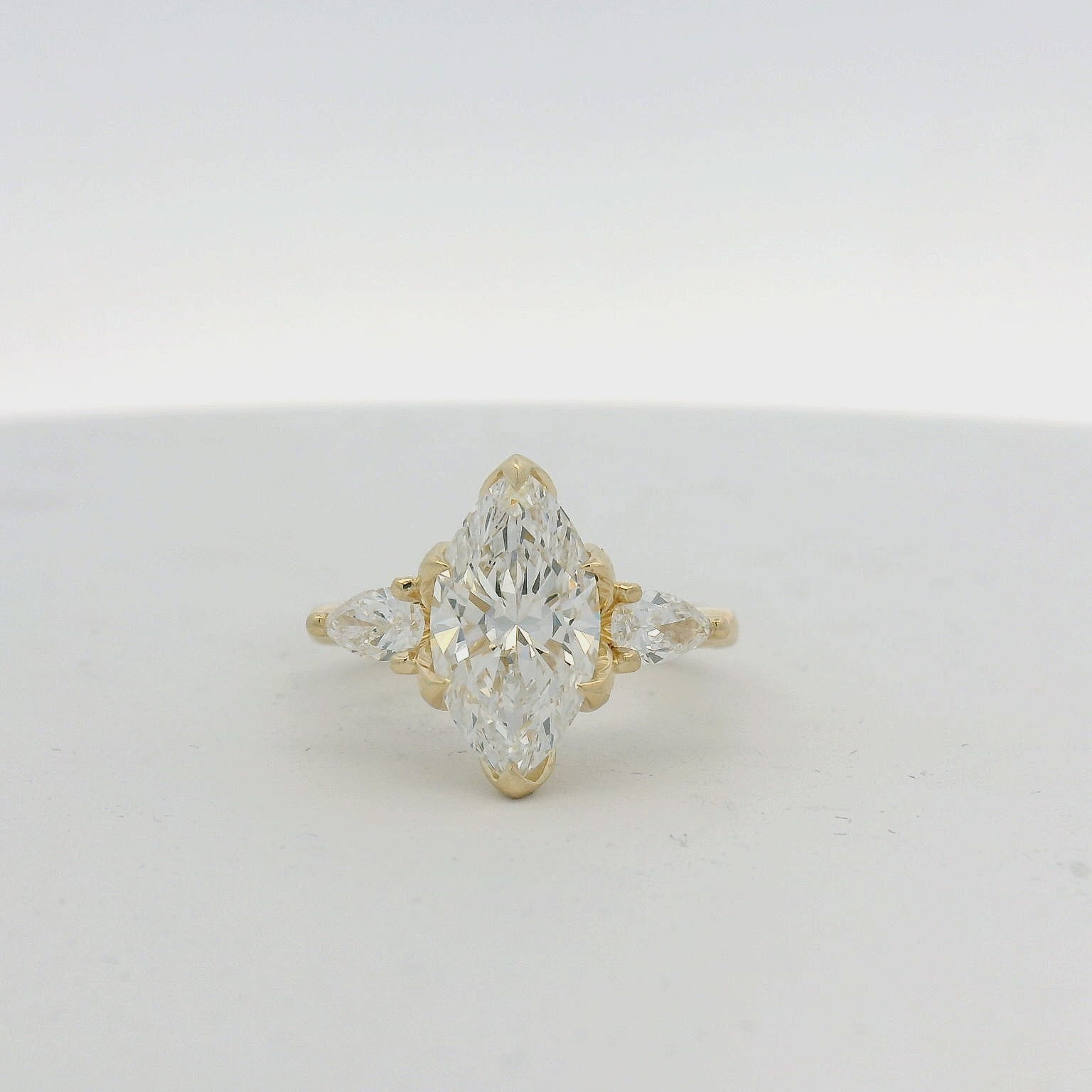 14KT Yellow Gold Marquise and Pear Three Stone Engagement Ring with Tulip Setting