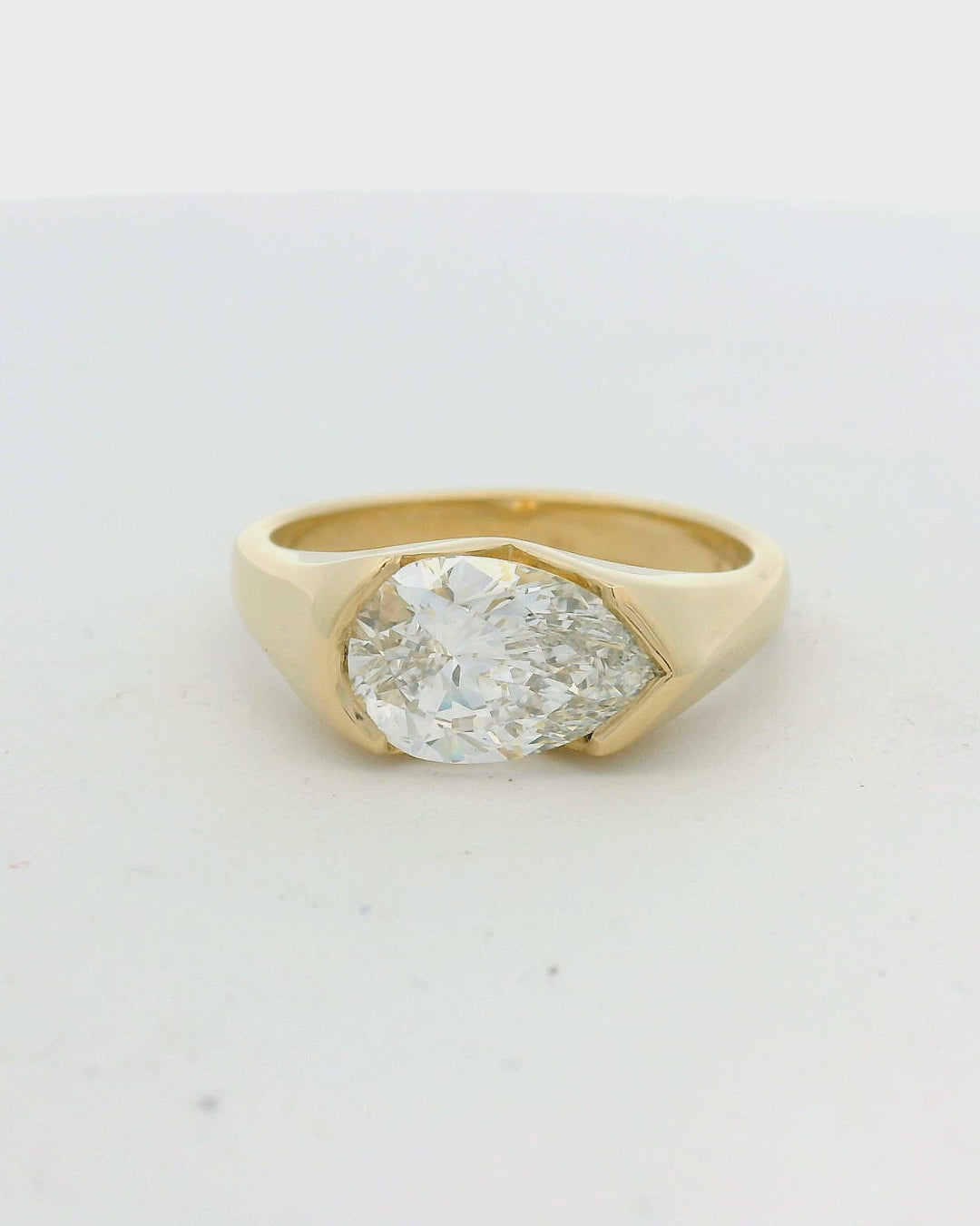 14KT yellow gold half bezel east-west pear diamond engagement ring