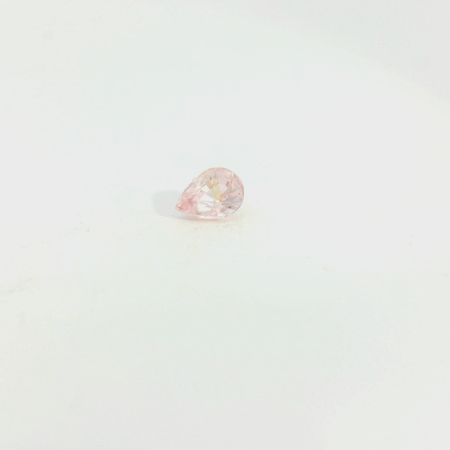 Loose Stone With One 0.70Ct Pear Sapphire orangy pink Padparadscha
