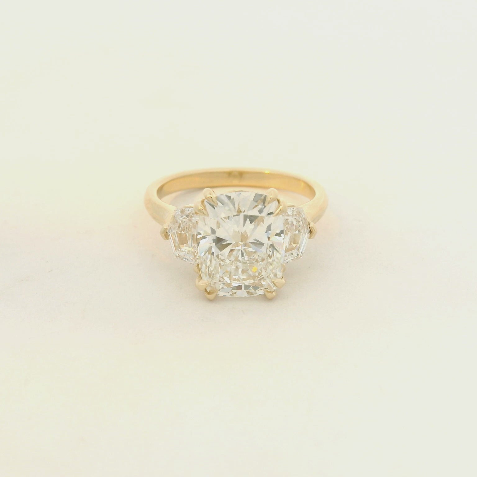 14k yellow gold ring cushion center with cadillac side stones