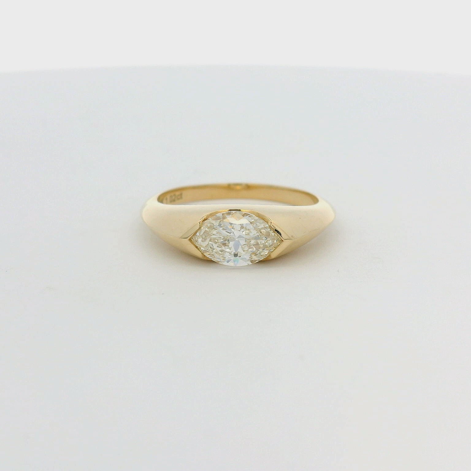 14KT yellow gold east-west half bezel set 1.02ct marquise diamond ring