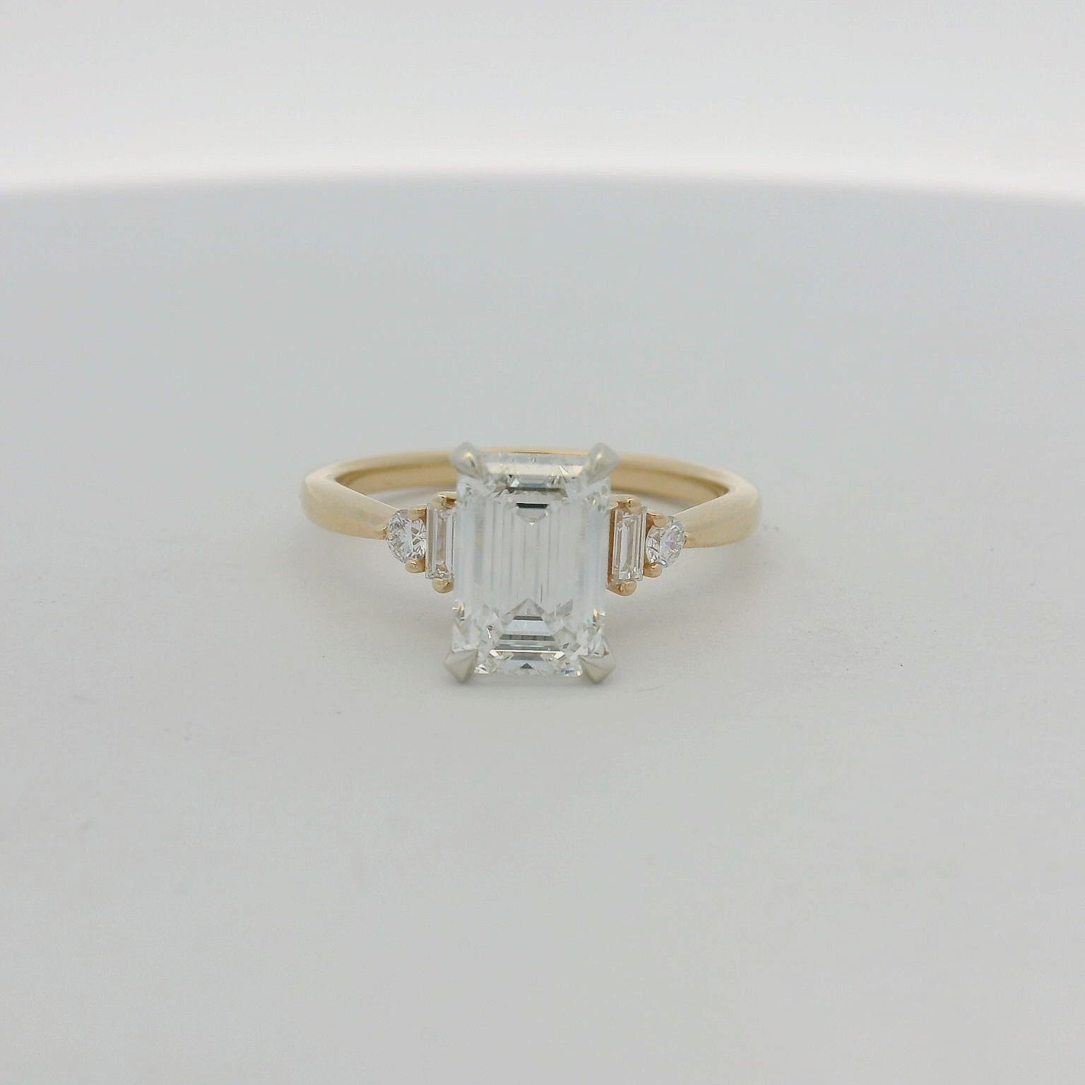 14KT yellow two tone Emerald cut baguette side stones engagement ring