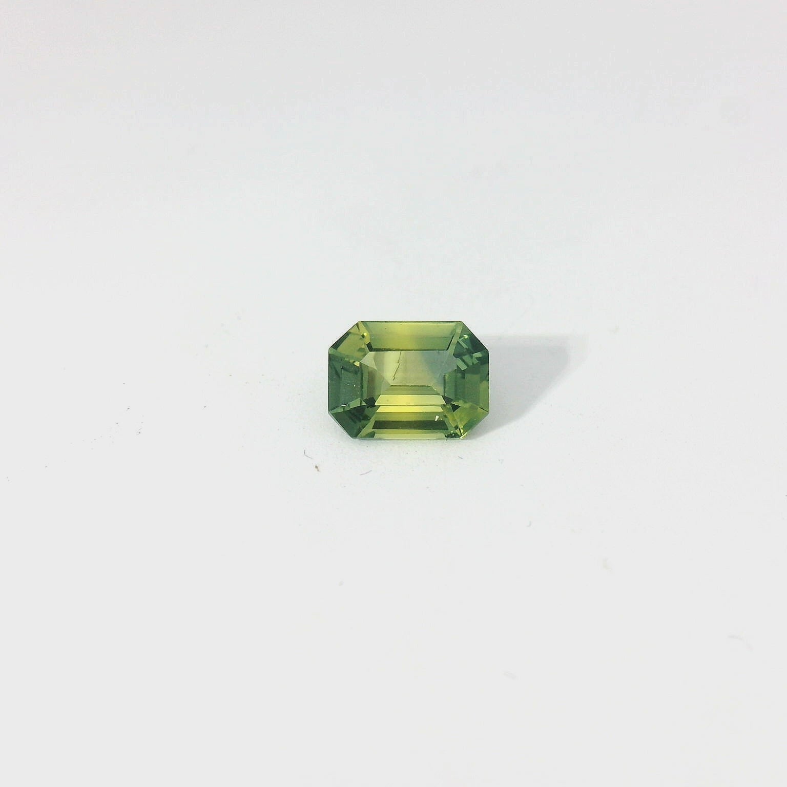 green emerald cut sapphire
