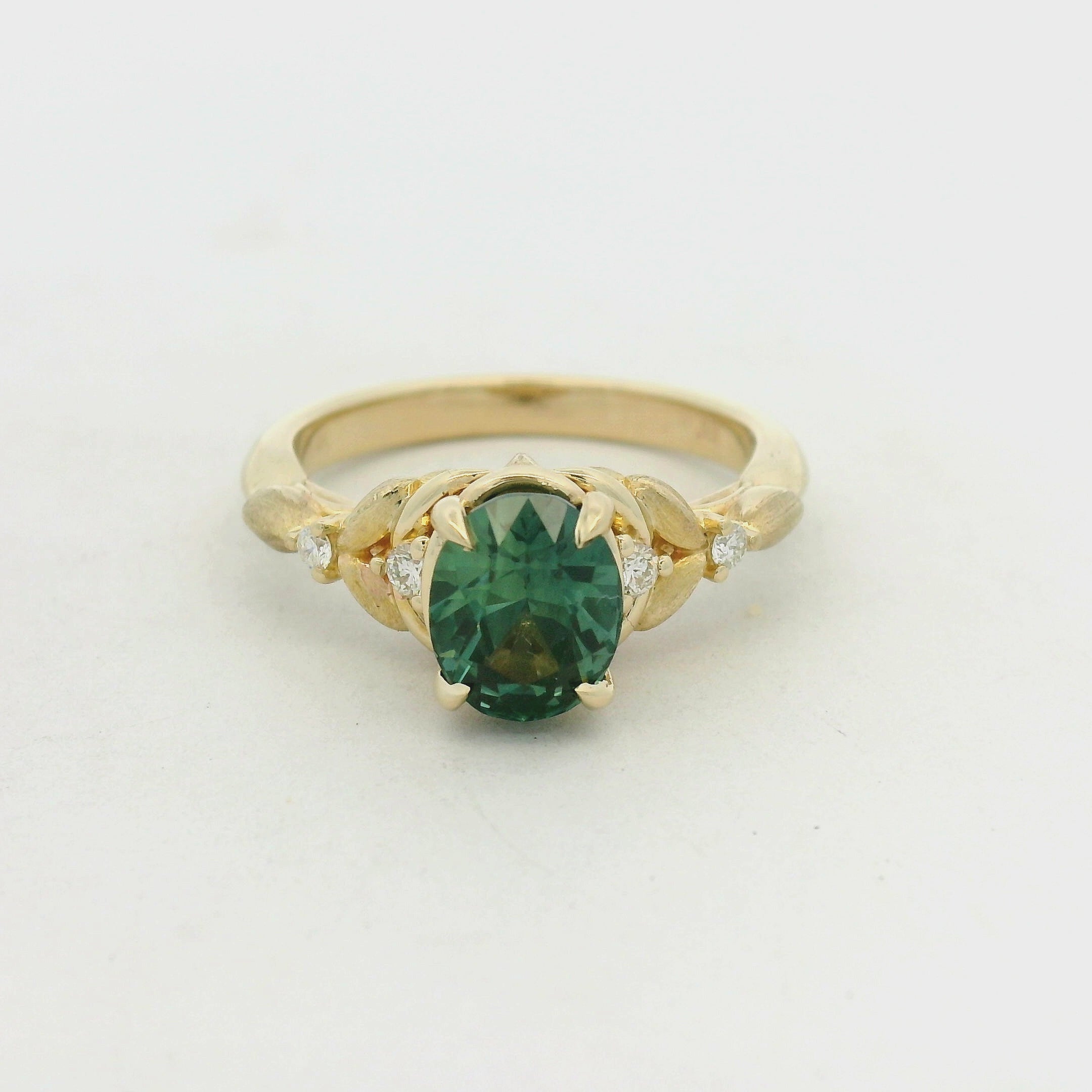 Oval Green Tourmaline Leaf Motif Ring in Yellow Gold