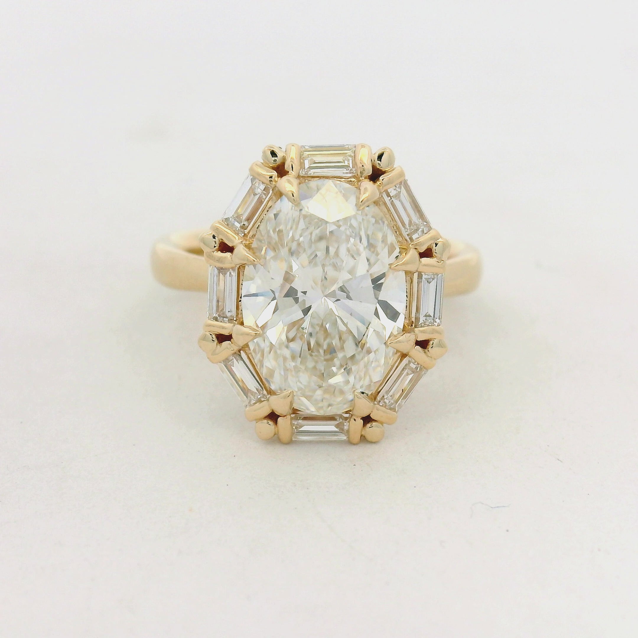 Oval Diamond Baguette Halo Ring in Yellow Gold