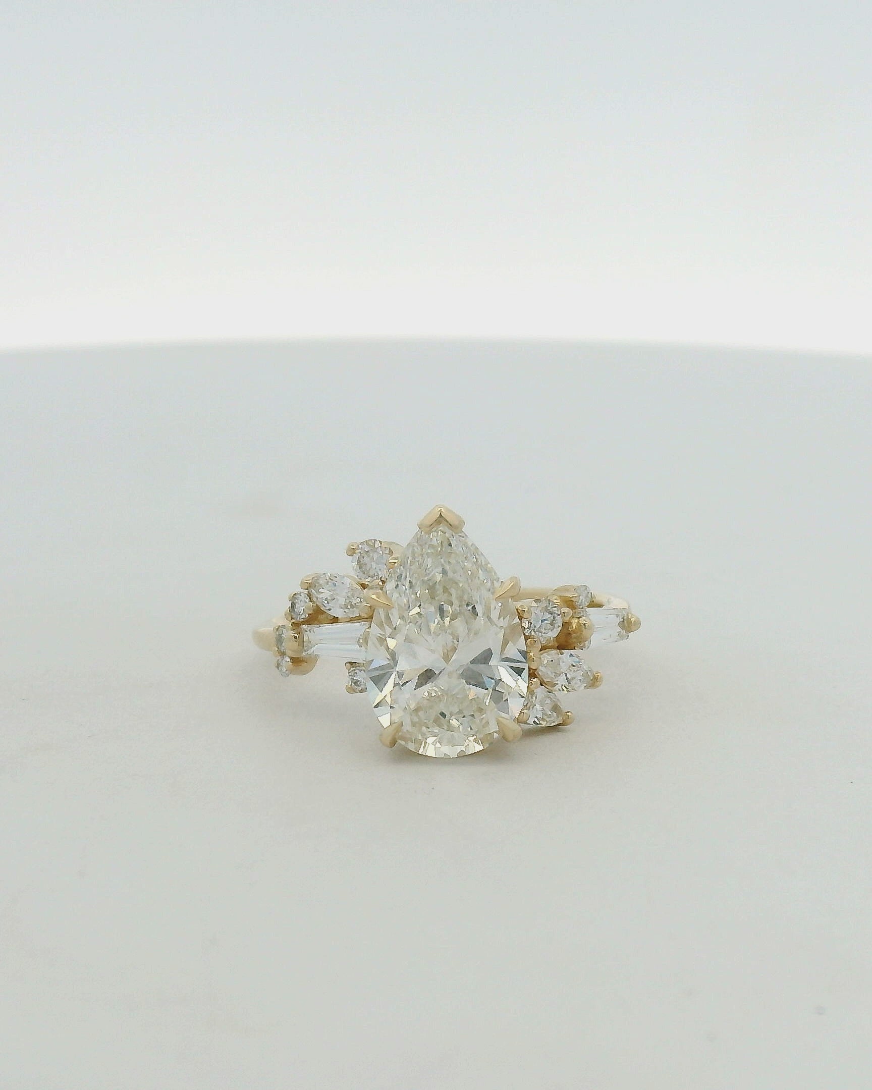 Pear Cut Diamond Asymmetrical Cluster Ring in Yellow Gold