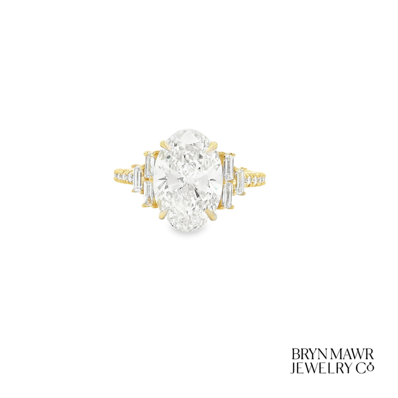 Yellow Gold Oval Diamond Ring with Stepped Baguette Accents