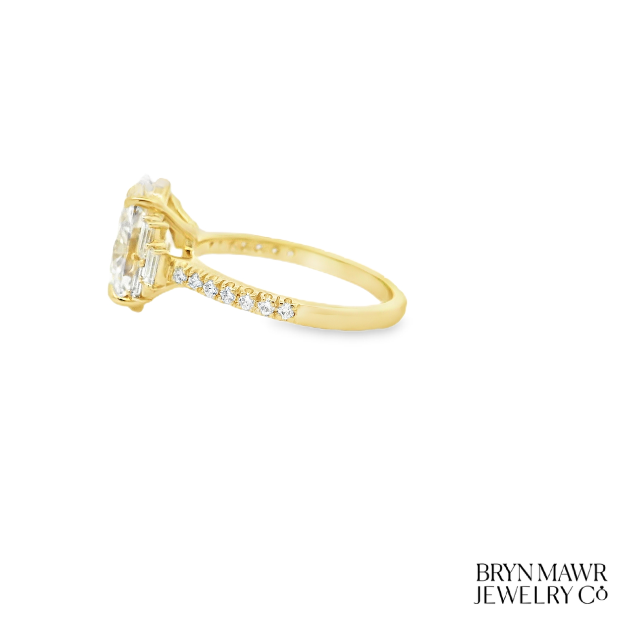 Yellow Gold Oval Diamond Ring with Stepped Baguette Accents