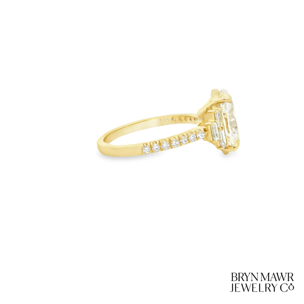 Yellow Gold Oval Diamond Ring with Stepped Baguette Accents